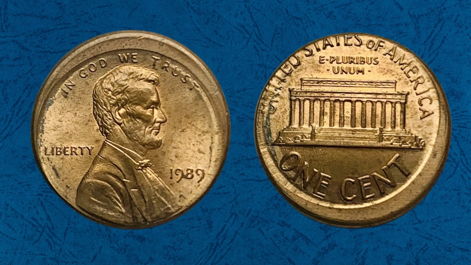 1989 Lincoln cent off-center strike error showing 20% shift with blank crescent area and partial design visible